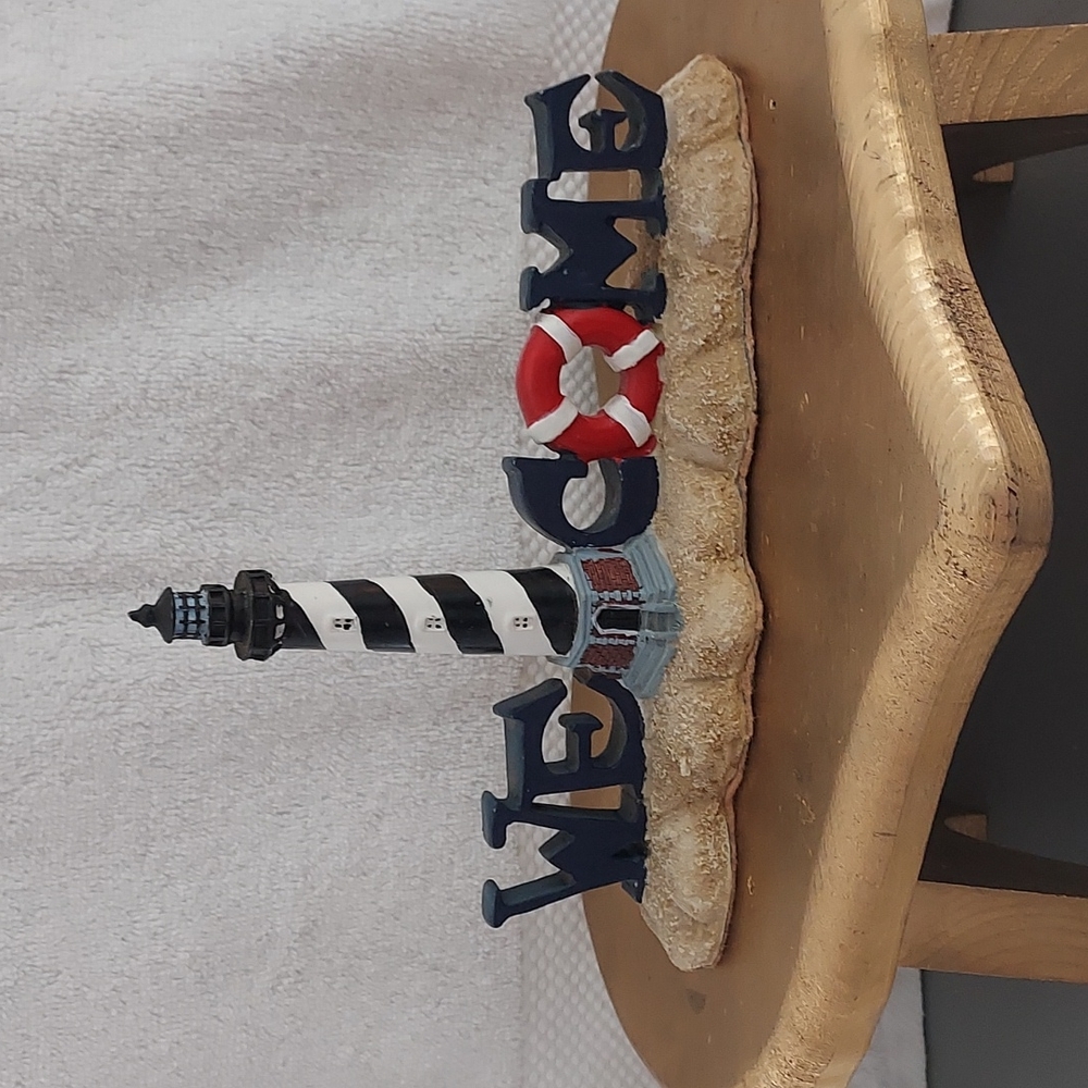 A light house welcome sign